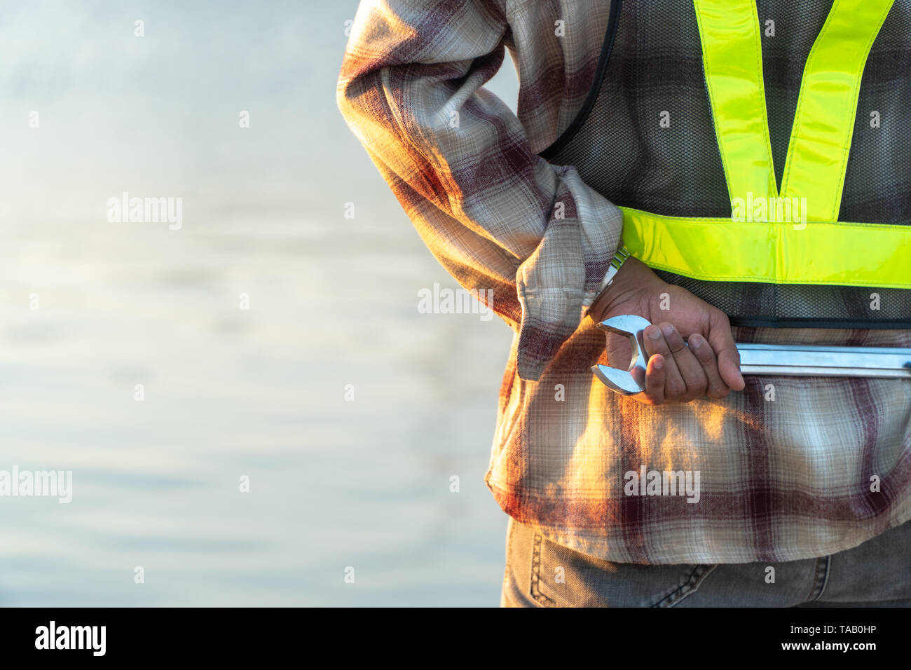 Close up back view of Engineers are hold equipment behind. Concepts of