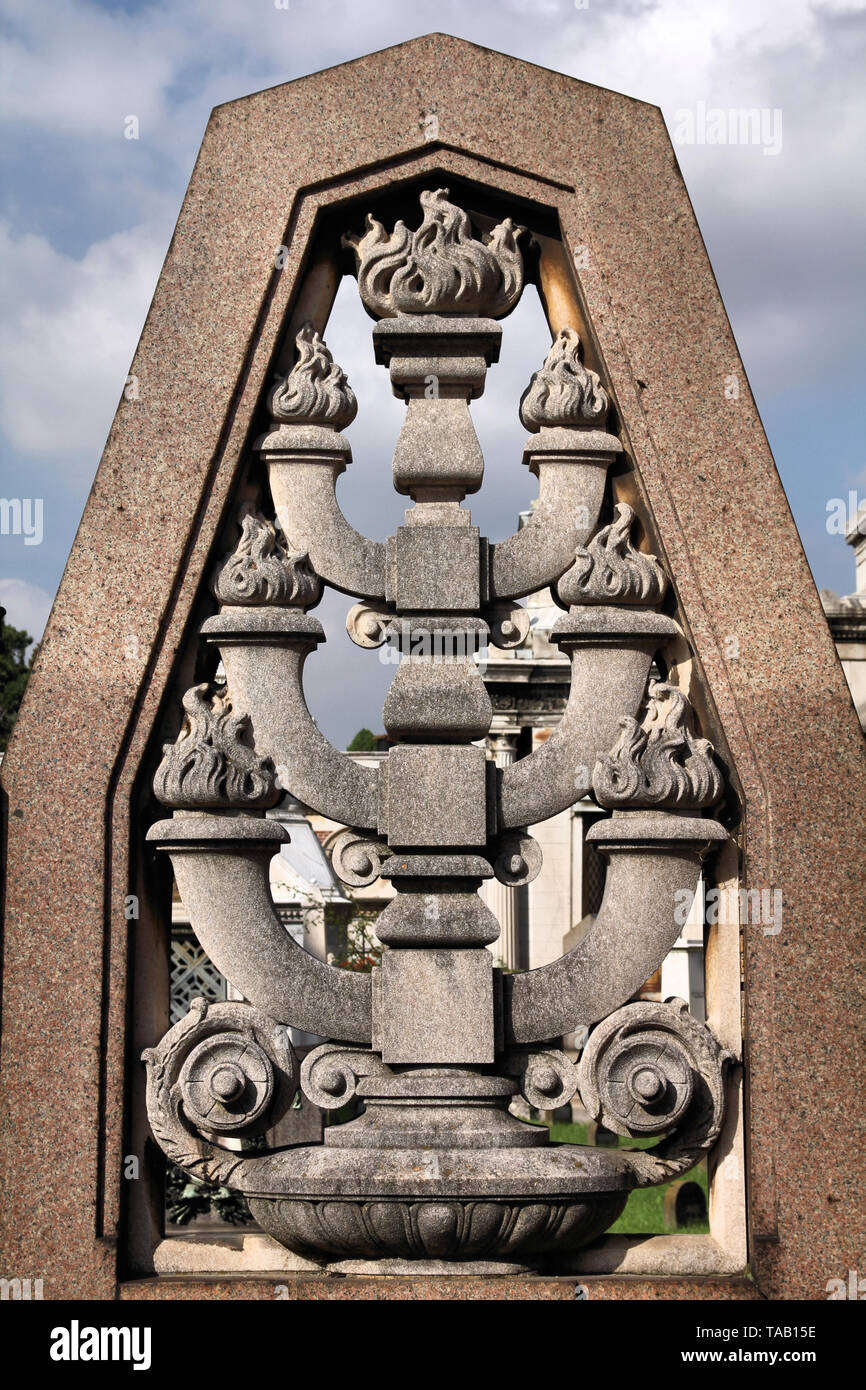 Menorah Jewish symbol in a grave stone in Milan Monumental Cemetery