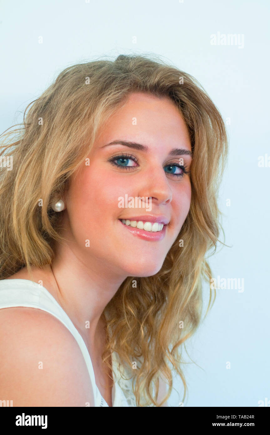 Young woman smiling and looking at the camera. Stock Photo