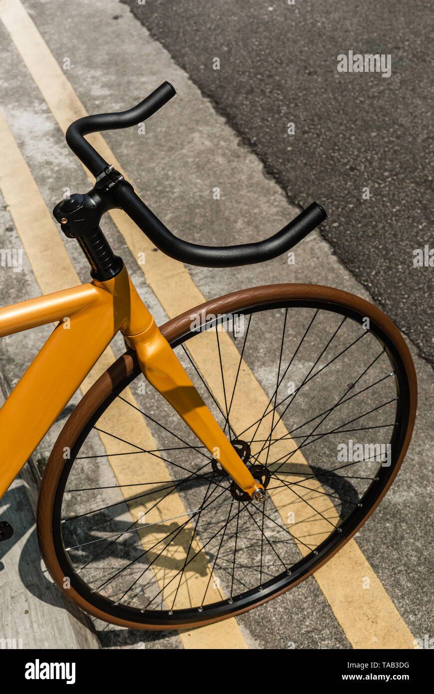 vintage yellow color bike on road side Stock Photo Alamy