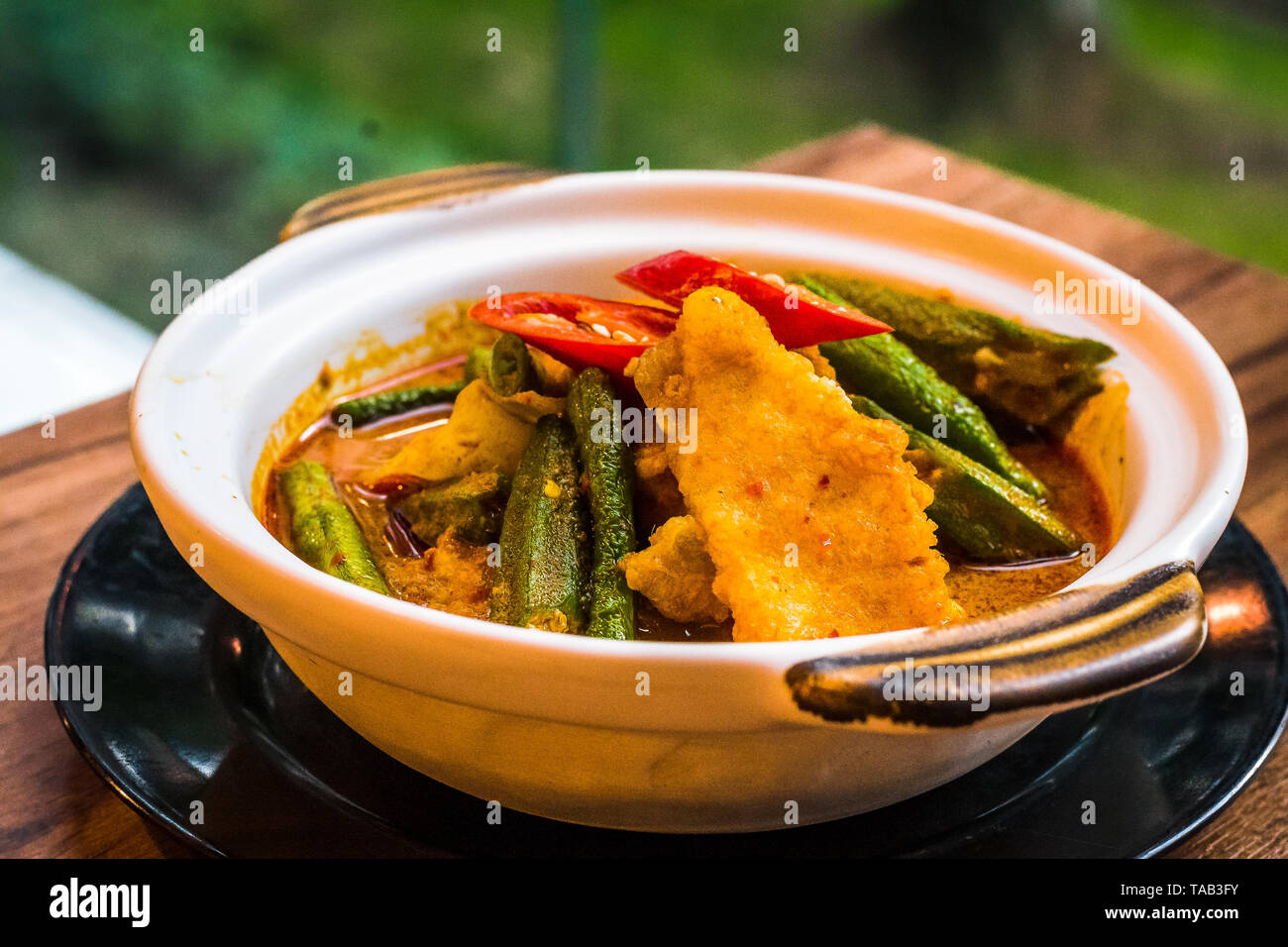 Mild fish curry with chilli, lady's fingers, okra, long beans, snap