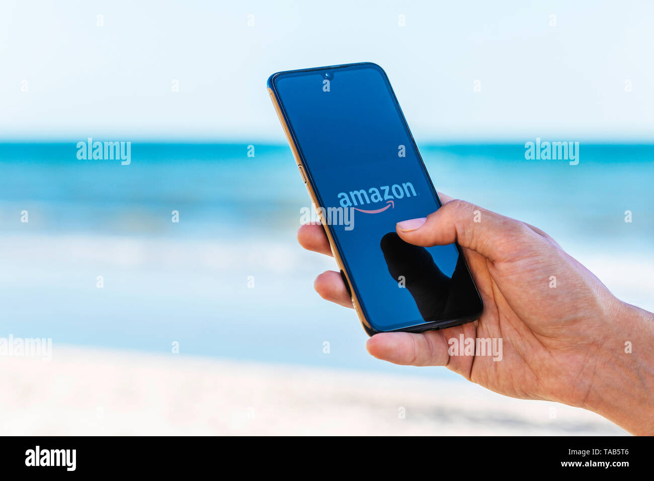 Matalascañas, Spain 12/05/2019 - Amazon app on Xiaomi Mi 9 phone screen on the beach, make purchases in Amazon from the beach Stock Photo