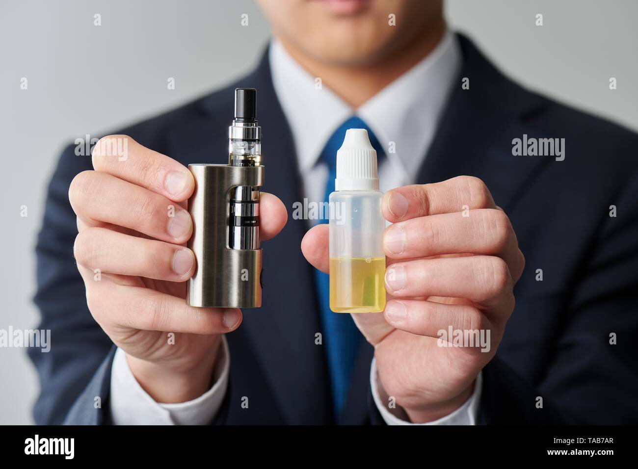 japanese electronic cigarette The Heat (Not Burn) is on in Japan Young Japanese man smoking electronic