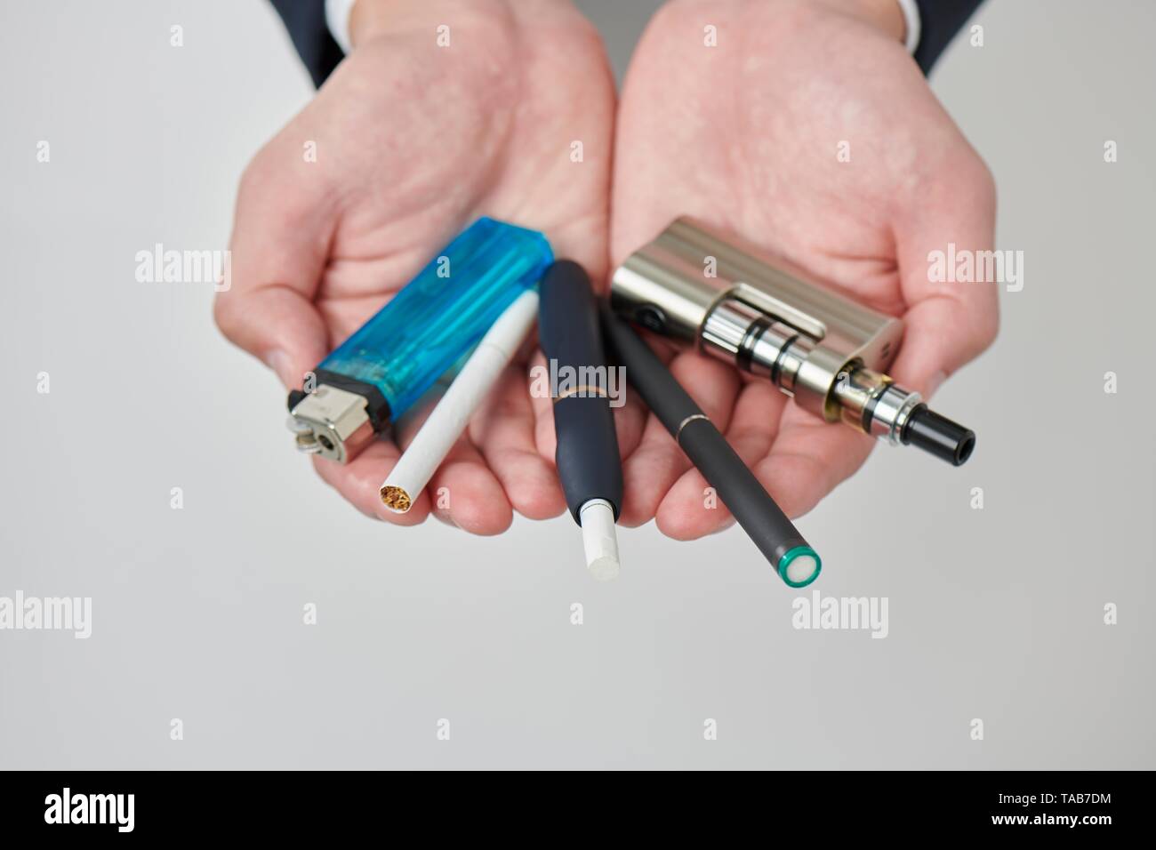 Young Japanese man smoking electronic cigarette Stock Photo - Alamy