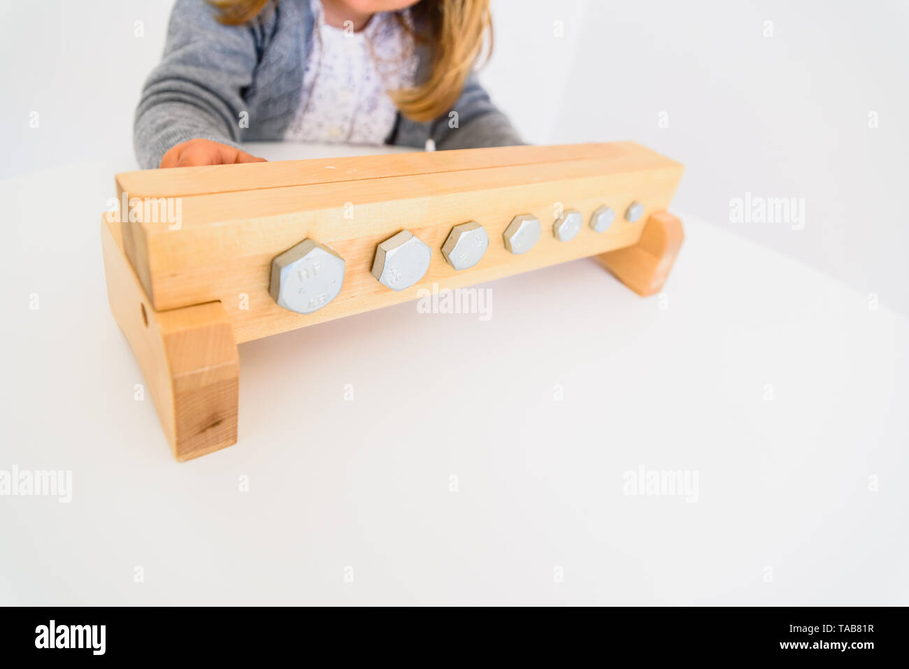 Girl handling tools to tighten nuts and bolts Stock Photo Alamy