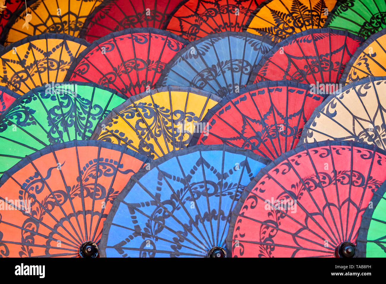 colorful display of umbrellas in market in Myanmar. Stock Photo
