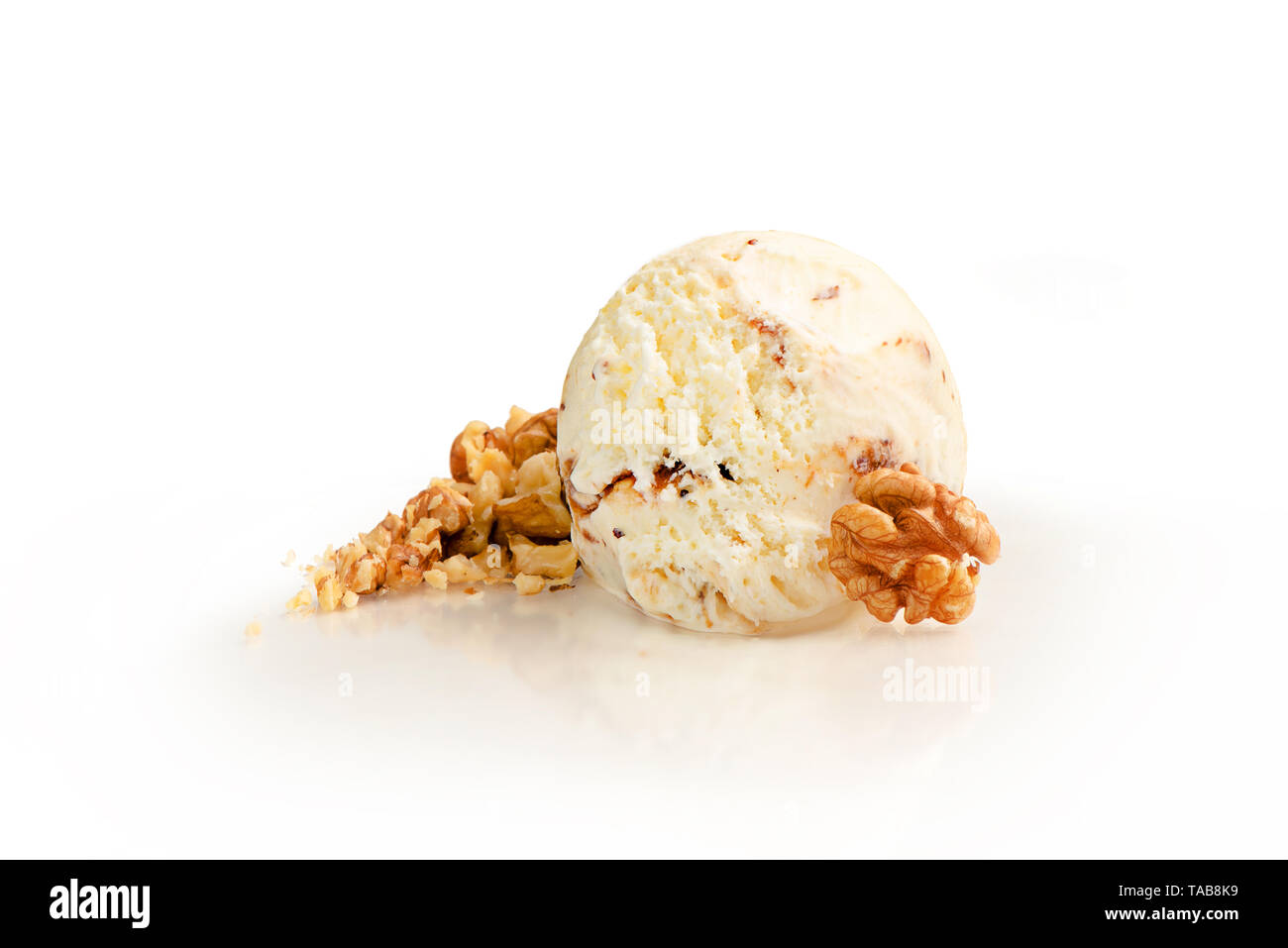 Ice cream ball, walnut and vanilla flavor with ingredients, isolated on a white background. Stock Photo