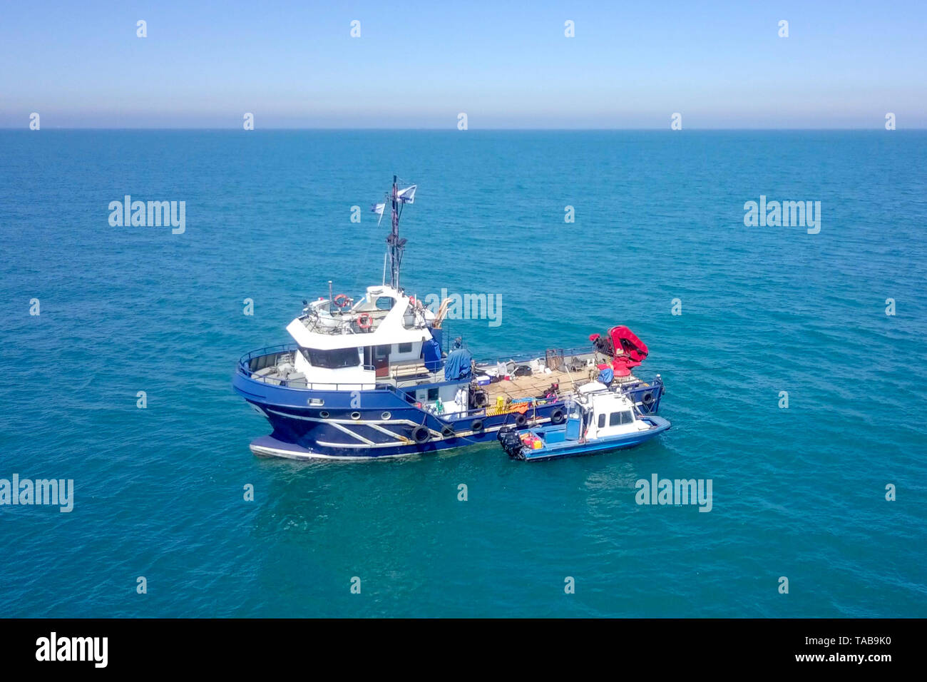 Big sea small boat hi-res stock photography and images - Alamy