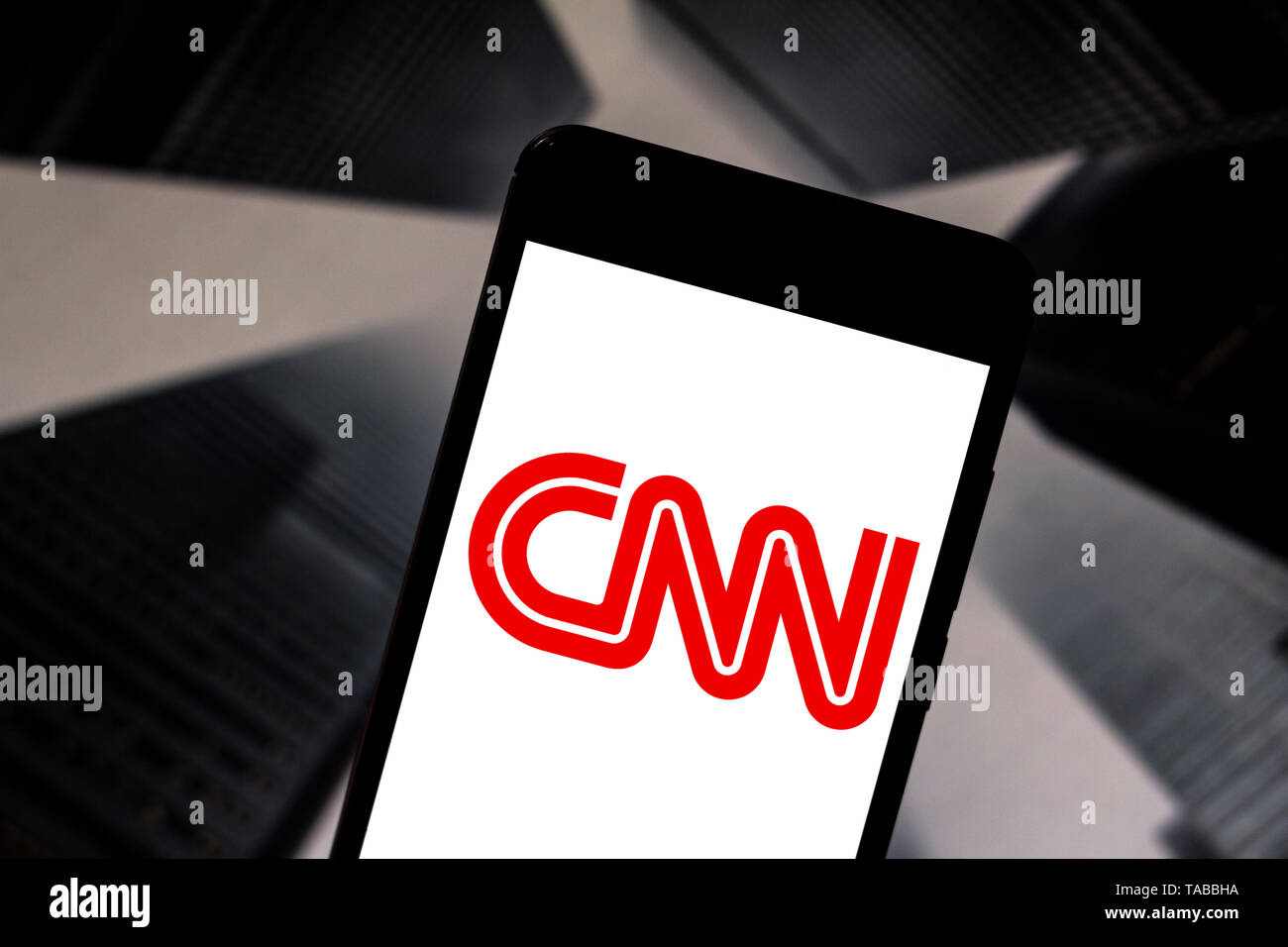 In this photo illustration the Cable News Network (CNN) logo is seen displayed on a smartphone. Stock Photo