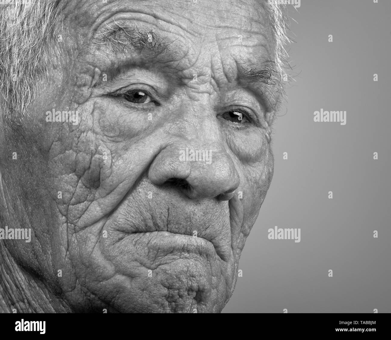 Monochromatic portrait of a Caucasian Spanish old man with white hair. Spain. Stock Photo