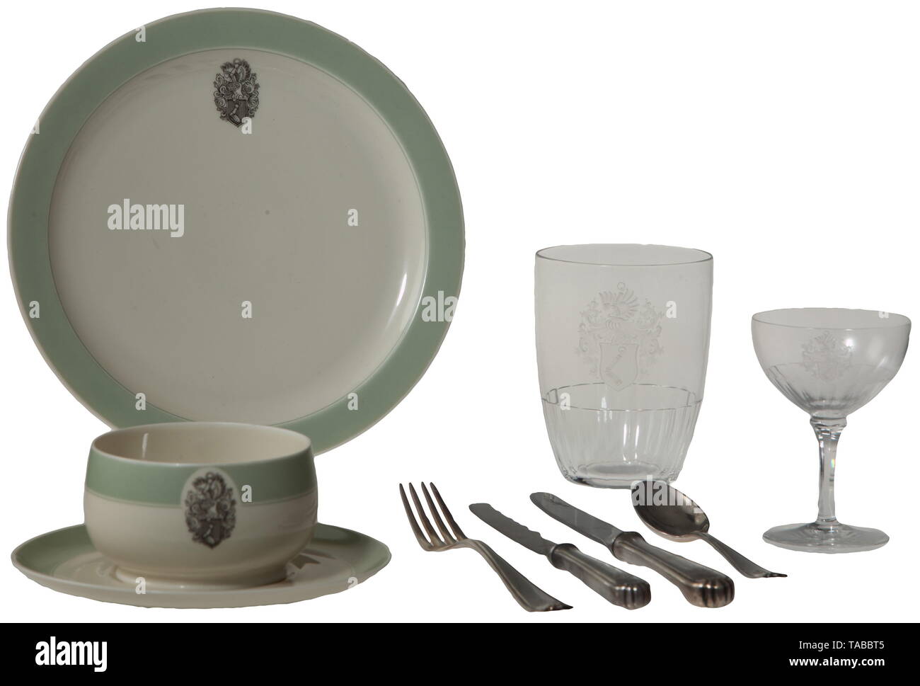 Hermann Göring - a galley set from his personal airplane, a JU 290 Originally taken by a U.S. Army officer from the airfield at Ainring near Obersalzberg. Contents of box consist of 4 plates, 4 cups, 4 drinking glasses (one with crack), 2 wine glasses, 4 forks, 4 spoons, 4 knives, and 3 fruit knives, all with Göring crest. Three of the knives with replaced Henckels blades. All pieces stored in wooden box with compartments and inserts to protect contents during transport. Silver plated flatware marked on reverse 'BSF90'. China plates marked on the reverse with a Bavarian cro, Editorial-Use-Only Stock Photo