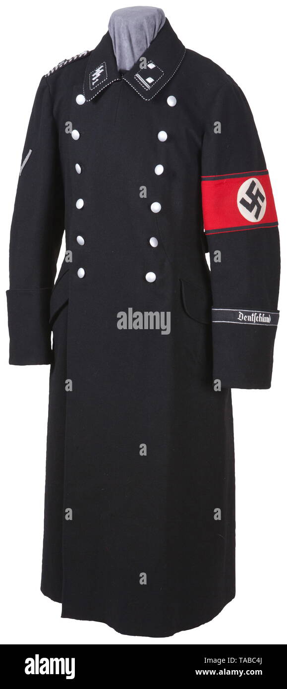 An Allgemeine SS officer's overcoat of an Hauptscharführer in 1st SS-Standarte 'Deutschland' Fine black wool with black-silver corded piping, hand-embroidered silver wire thread collar unit tab, two aluminium pipings, silver tress rank tab, two side pockets, a double row of six RZM-SS marked pebbled silver buttons, multi-piece wool armband, officer quality 'Deutschland' cuff title, old fighter's chevron. Silver and black braided shoulder board with 'D' (Deutschland) cipher. Well marked 'VA 1939', '52' black cotton lining. Very rare. USA-lot, see page 4. historic, historical, Editorial-Use-Only Stock Photo
