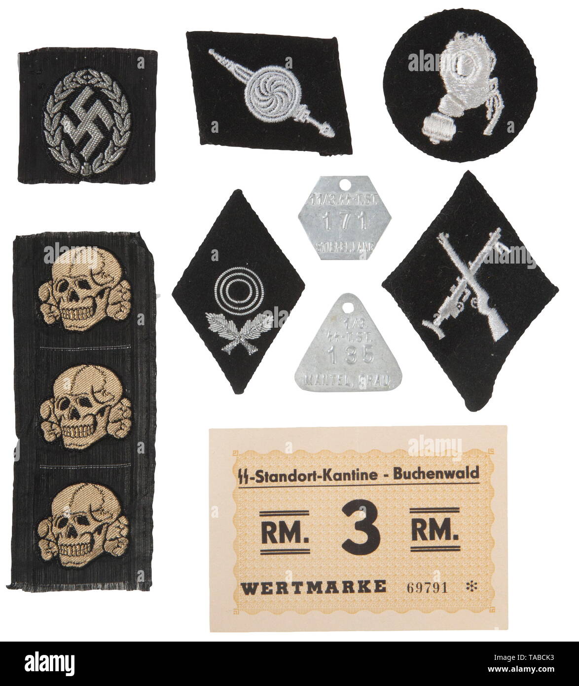 An SS insignia lot Three BeVo tropical hat death's heads, BeVo aux.-police 'schuma' cap insignia, embroidered 'Kaukasischer Waffen-Verband der SS' collar tab, embroidered gas protection patch, embroidered armourer NCO diamond, embroidered bullion 1st class marksmanship diamond, two aluminium garment tags and a 3 RM SS-Standortkantine-Buchenwald note. USA-lot, see page 4. historic, historical, 20th century, 1930s, 1940s, Waffen-SS, armed division of the SS, armed service, armed services, NS, National Socialism, Nazism, Third Reich, German Reich, Germany, military, militaria,, Editorial-Use-Only Stock Photo
