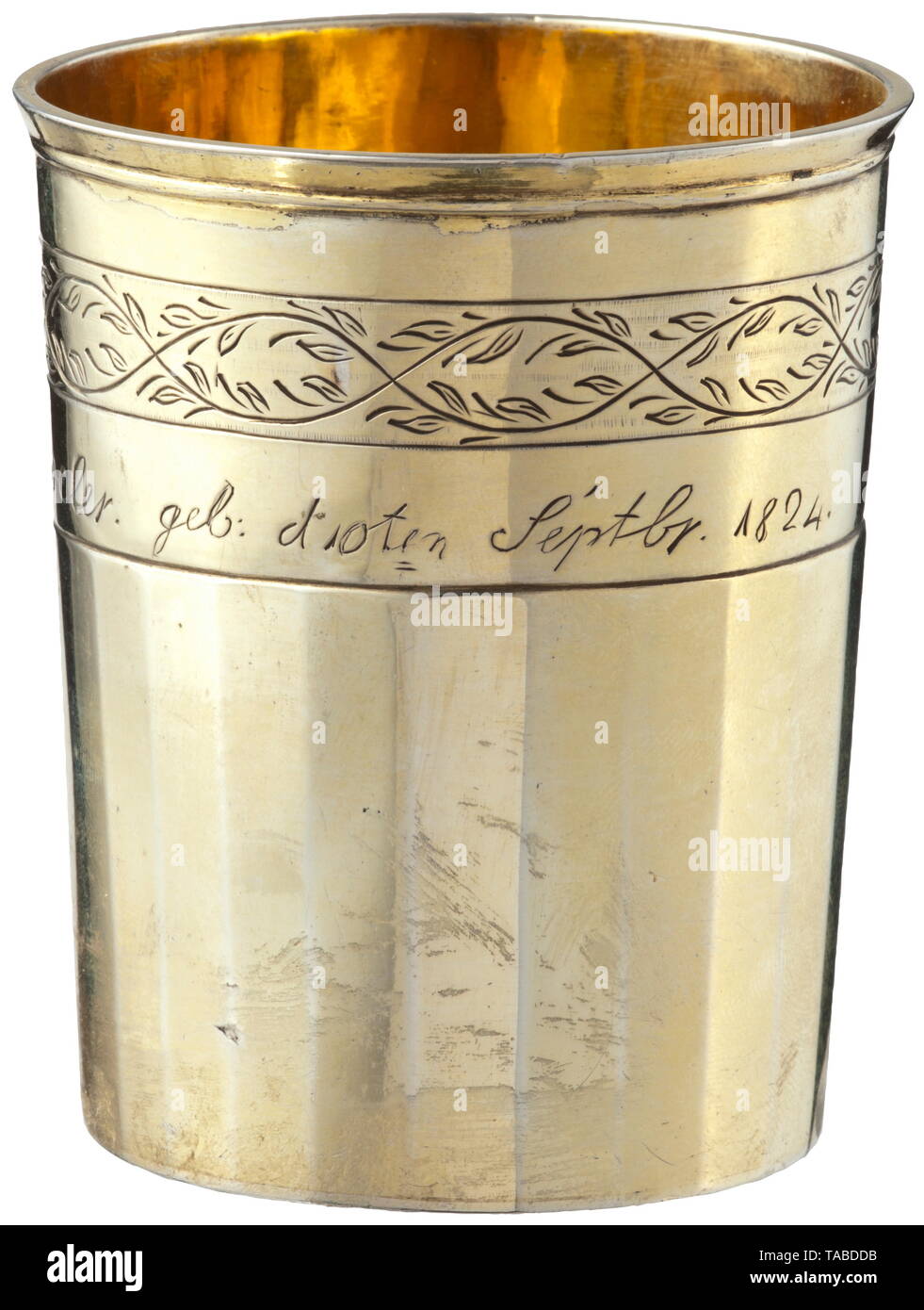 A silver cup, Viljandi, 18th century Faceted, slightly rubbed cup, the interior and exterior gold-plated, with slightly flared rim and simple tendril engraving, inscribed and dated 'Sophie Schoeler. geb. d 10ten Septbr. 1824' (tr. 'Sophie Schoeler. born 10 Sept. 1824'). The bottom engraved 'C.F. Göns. geb. d4.Juni1753 gest: d21 Juni 1830.' (tr. 'C.F. Göns. born 4 June 1753 died 21 June 1830.') and stamped with manufacturer's marks 'FG' and marks of fineness. Height 8 cm, weight 149.6 g. historic, historical, handicrafts, handcraft, craft, object,, Additional-Rights-Clearance-Info-Not-Available Stock Photo