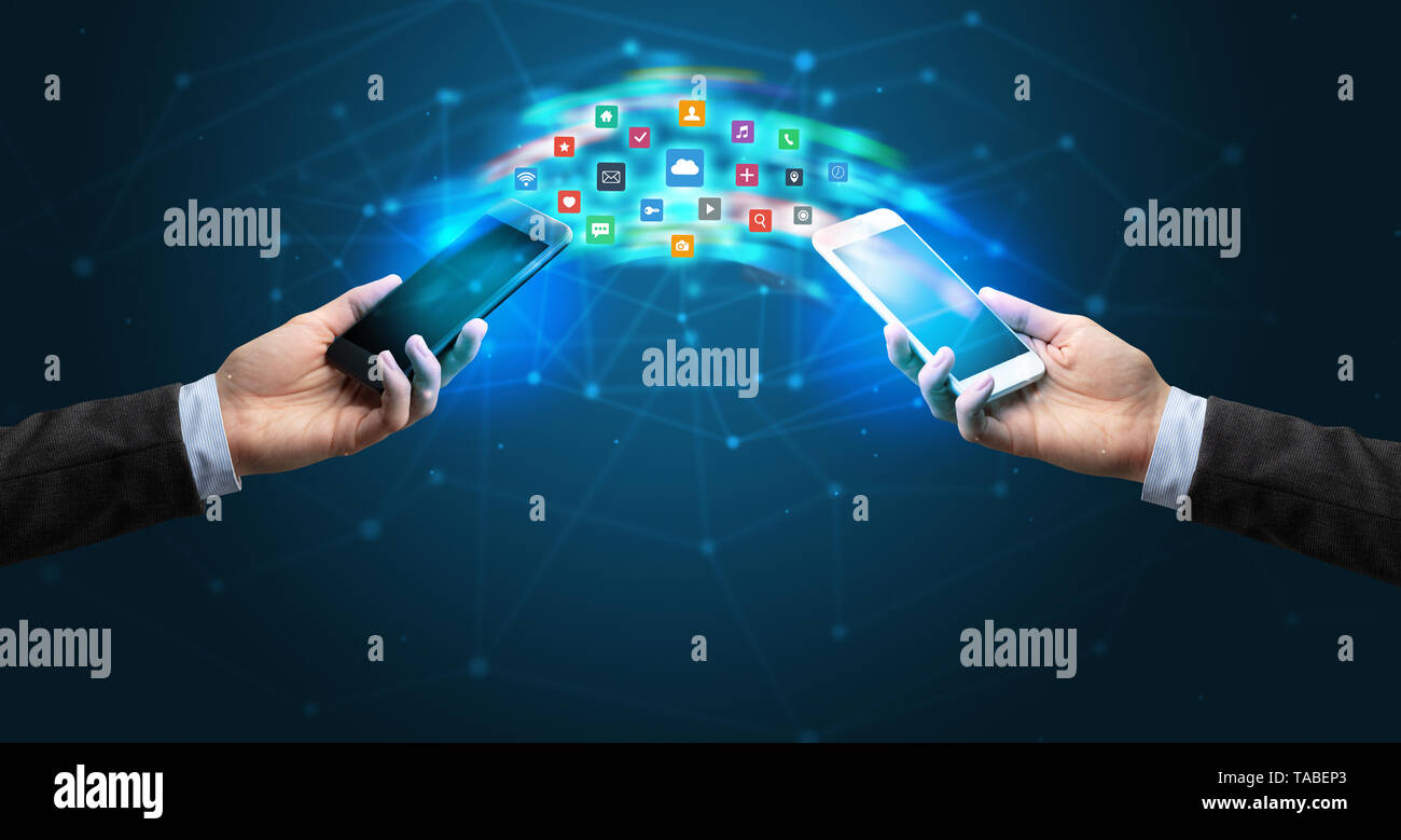 Two Apps Syncing Two mobile phones syncing applications concept Stock Photo - Alamy