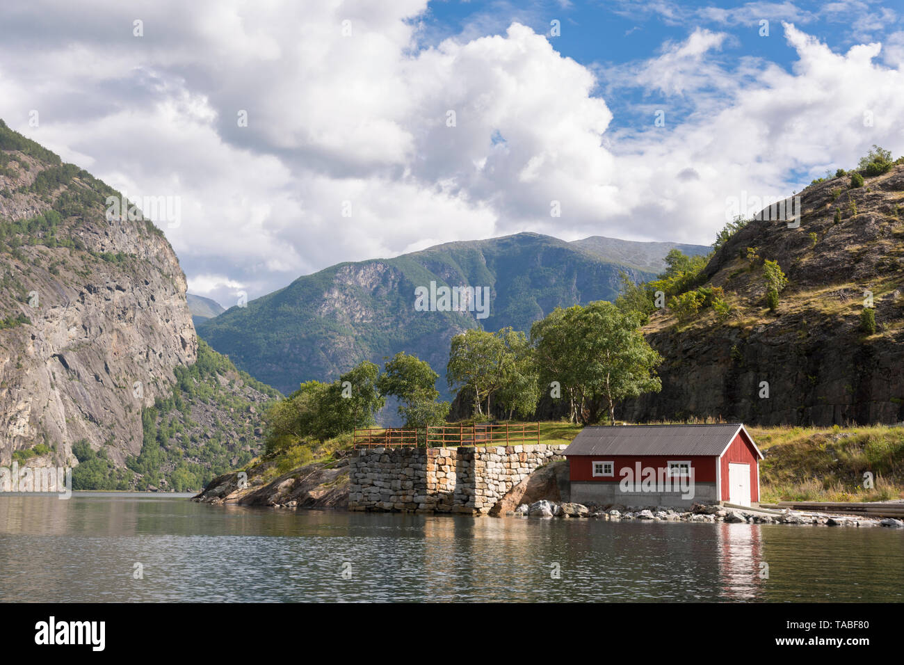 by boat between mountains on the Sognefjord in Laerdal, Norway Stock Photo