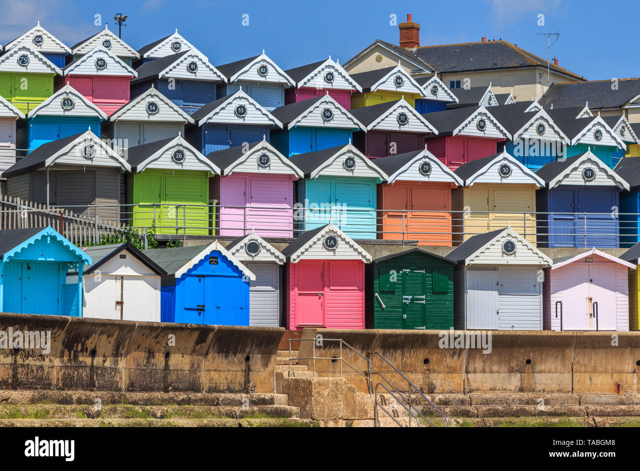 brightly coloured beach huts, very expensive property, seaside town of