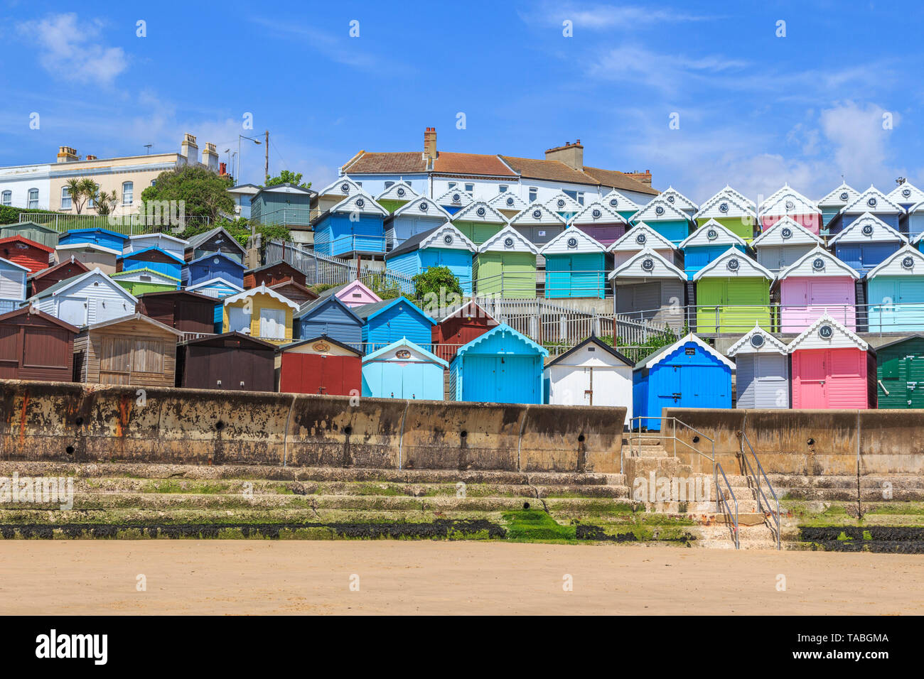brightly coloured beach huts, very expensive property, seaside town of