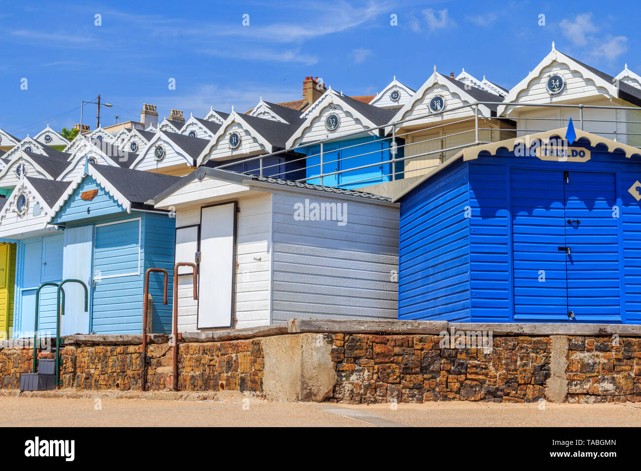 brightly coloured beach huts, very expensive property, seaside town of