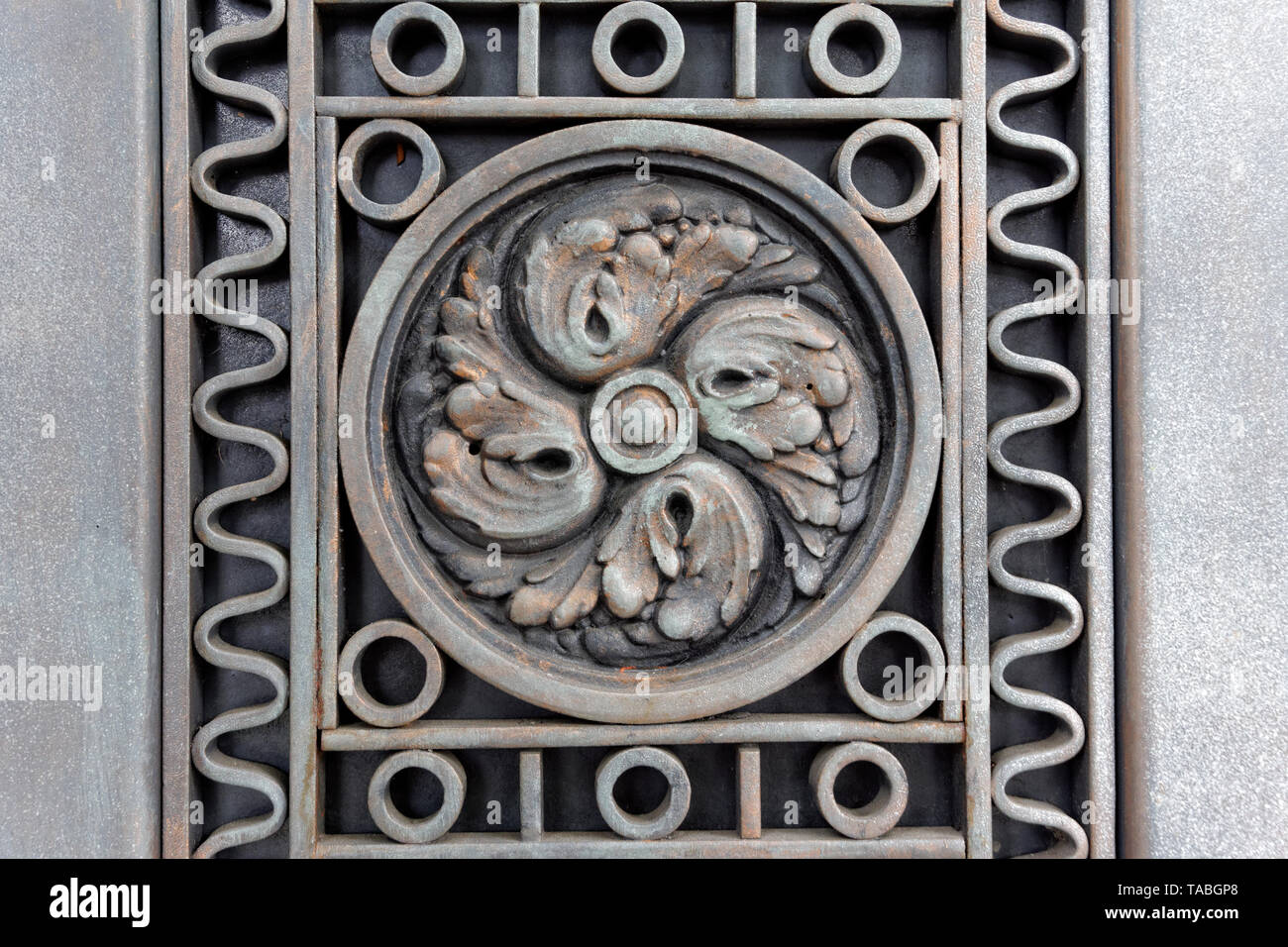 Detail of an ornate decorative copper grate Stock Photo