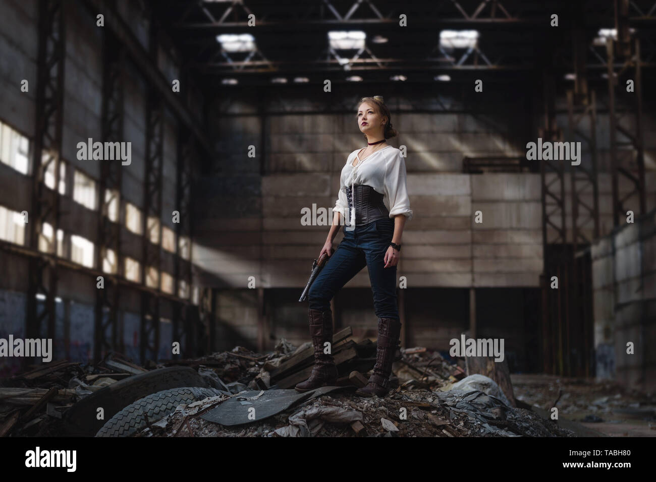 girl in a steampunk costume at an abandoned factory Stock Photo
