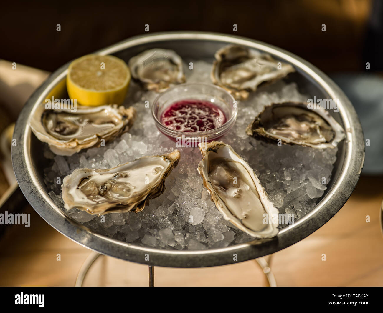 Beautifully presented platter of Oysters on the half shell. Stock Photo