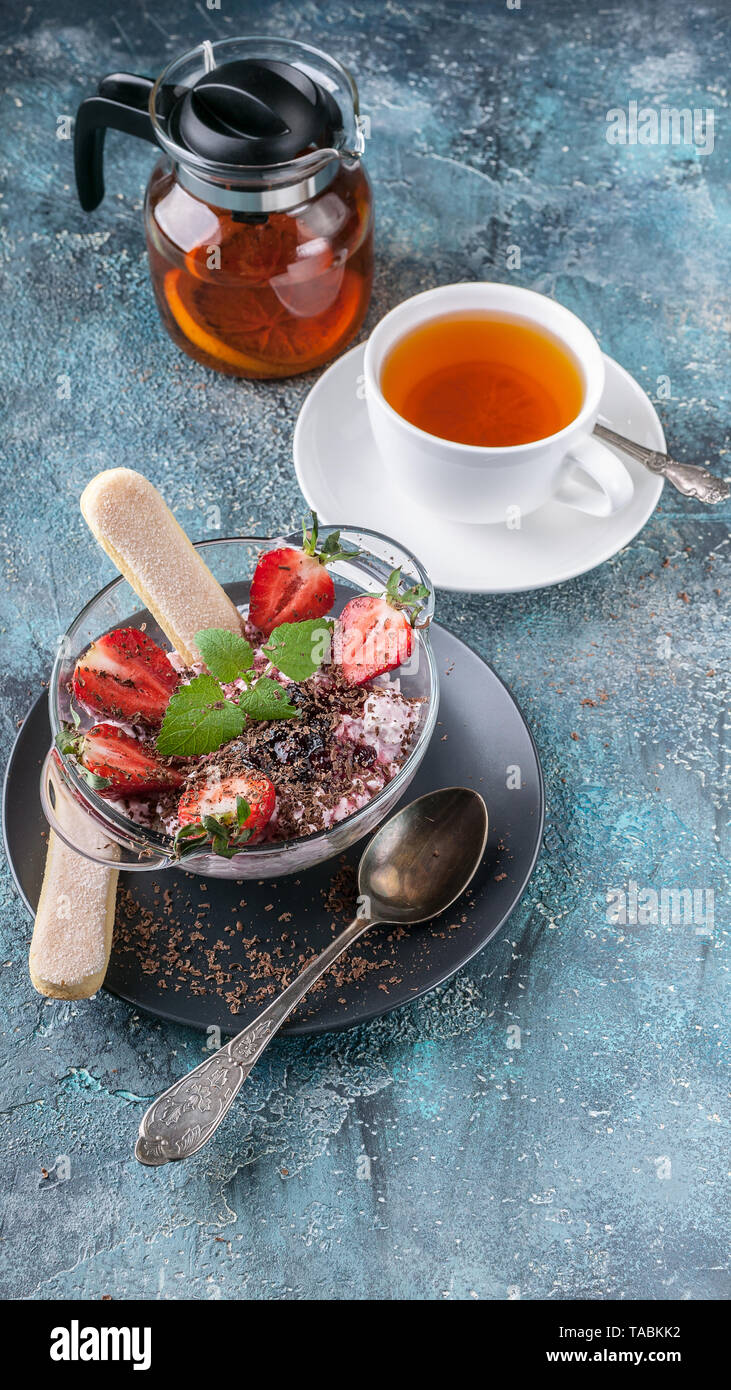 Curd Tea Homemade curd dessert. Fruit tea, fresh strawberries, mint leaves and ...