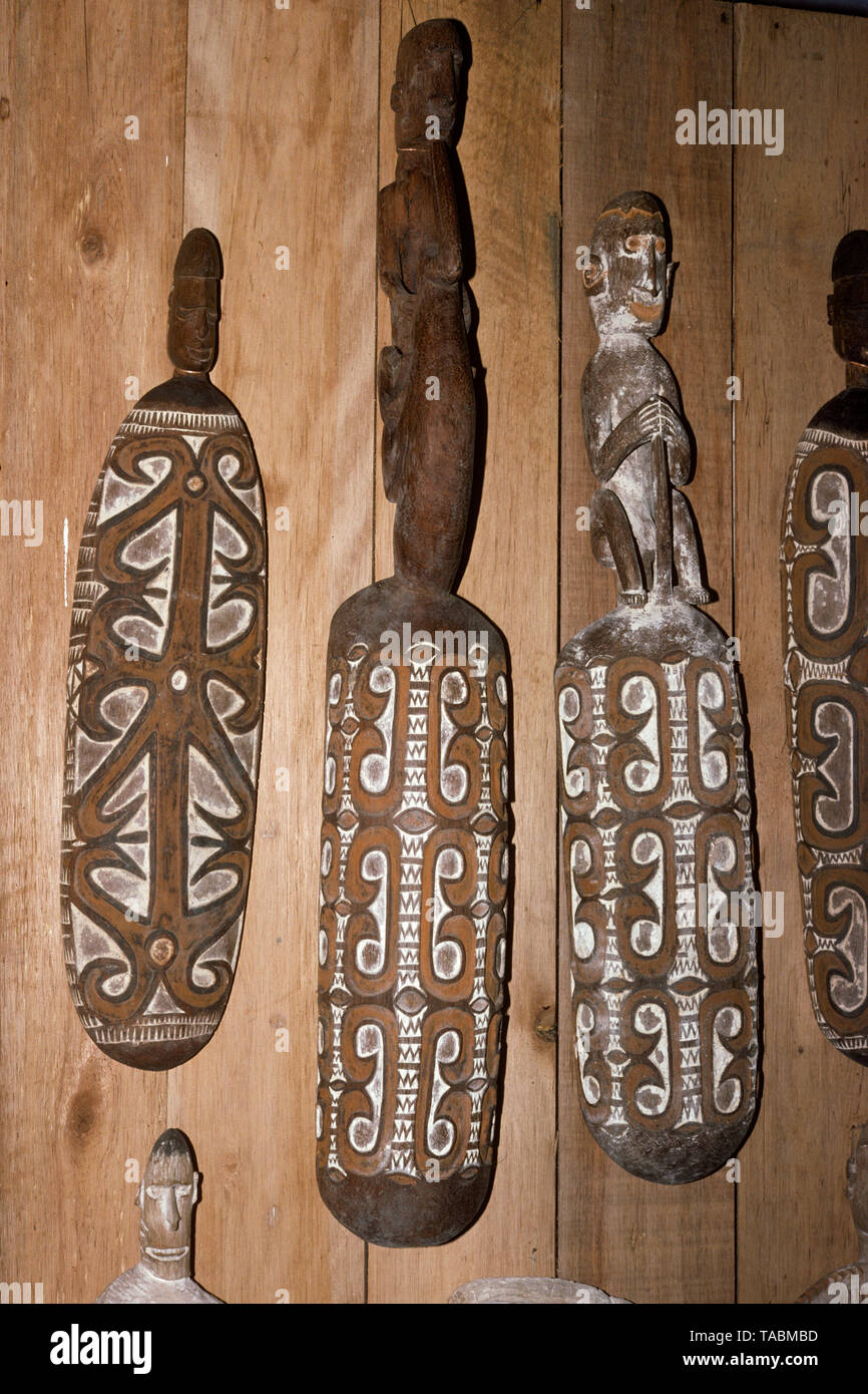 Asmat people: ethnic group living in the Papua province of Indonesia, along the Arafura Sea.  Asmat carvings at the Asmat Museum in Agats. Photograph  Stock Photo