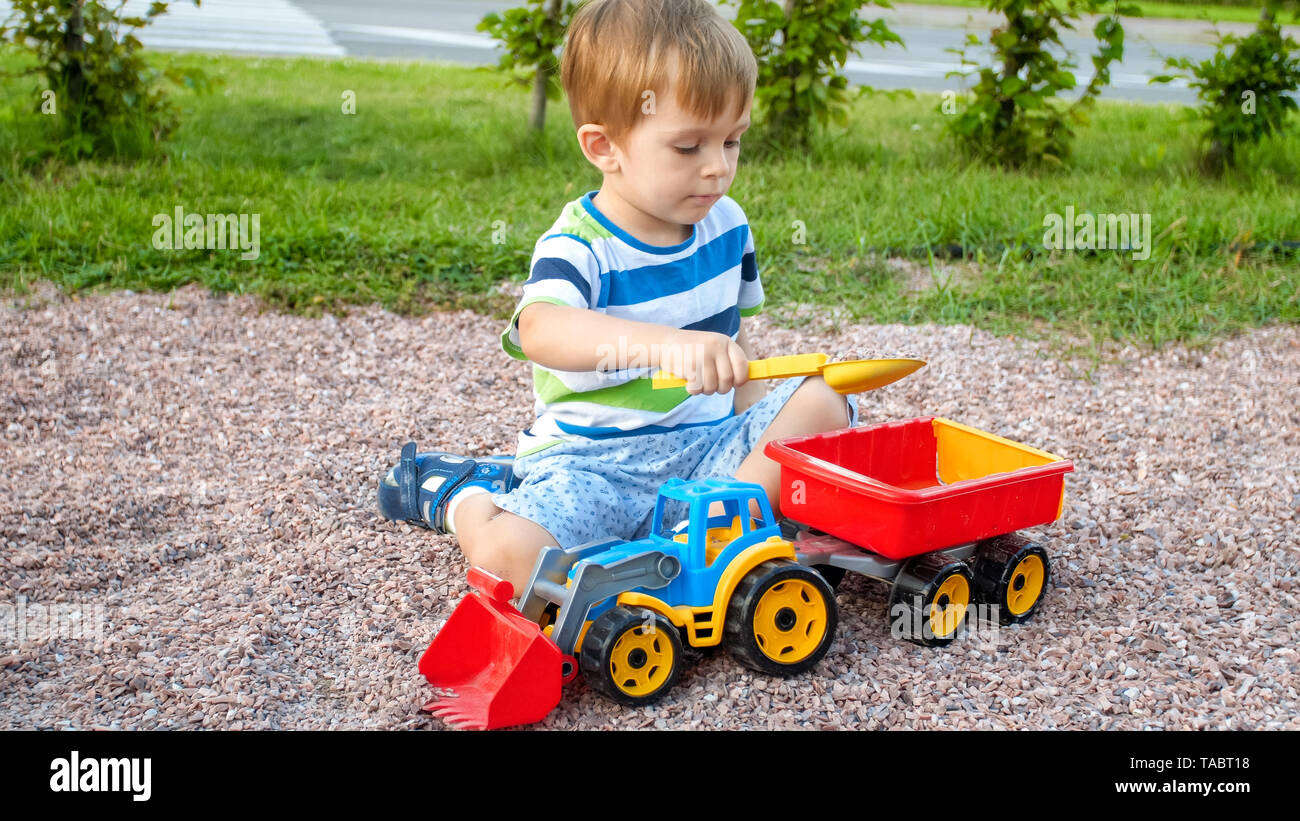 Little boy with truck and trailer hotsell