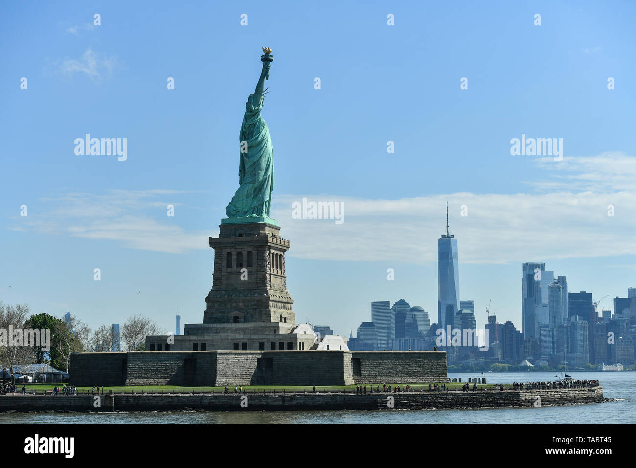 A view of the Statue of Liberty and New York skyline on May 16, 2019 in New York City. Stock Photo