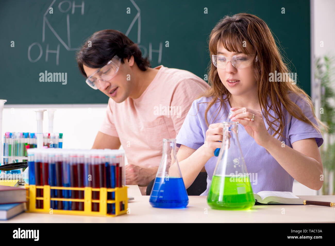 Two chemists students in classroom Stock Photo - Alamy