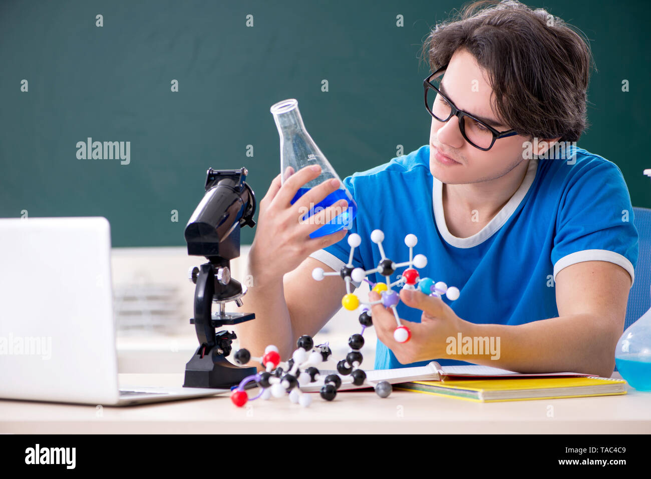 Young male student in the classroom Stock Photo
