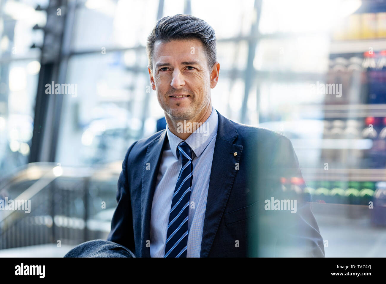 Portrait of smiling businessman on the move Stock Photo