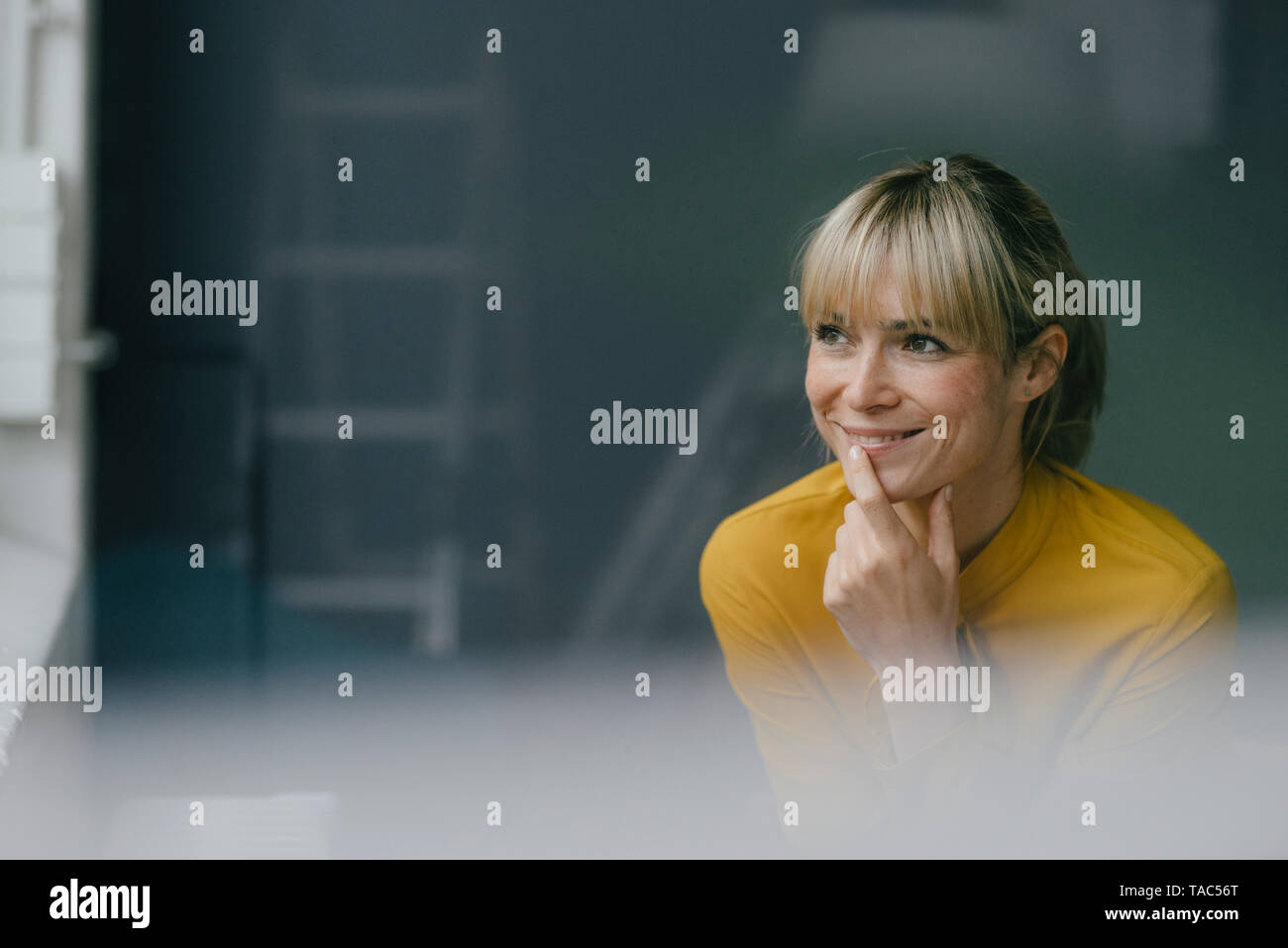 Portrait of a beautiful blond woman, smiling Stock Photo