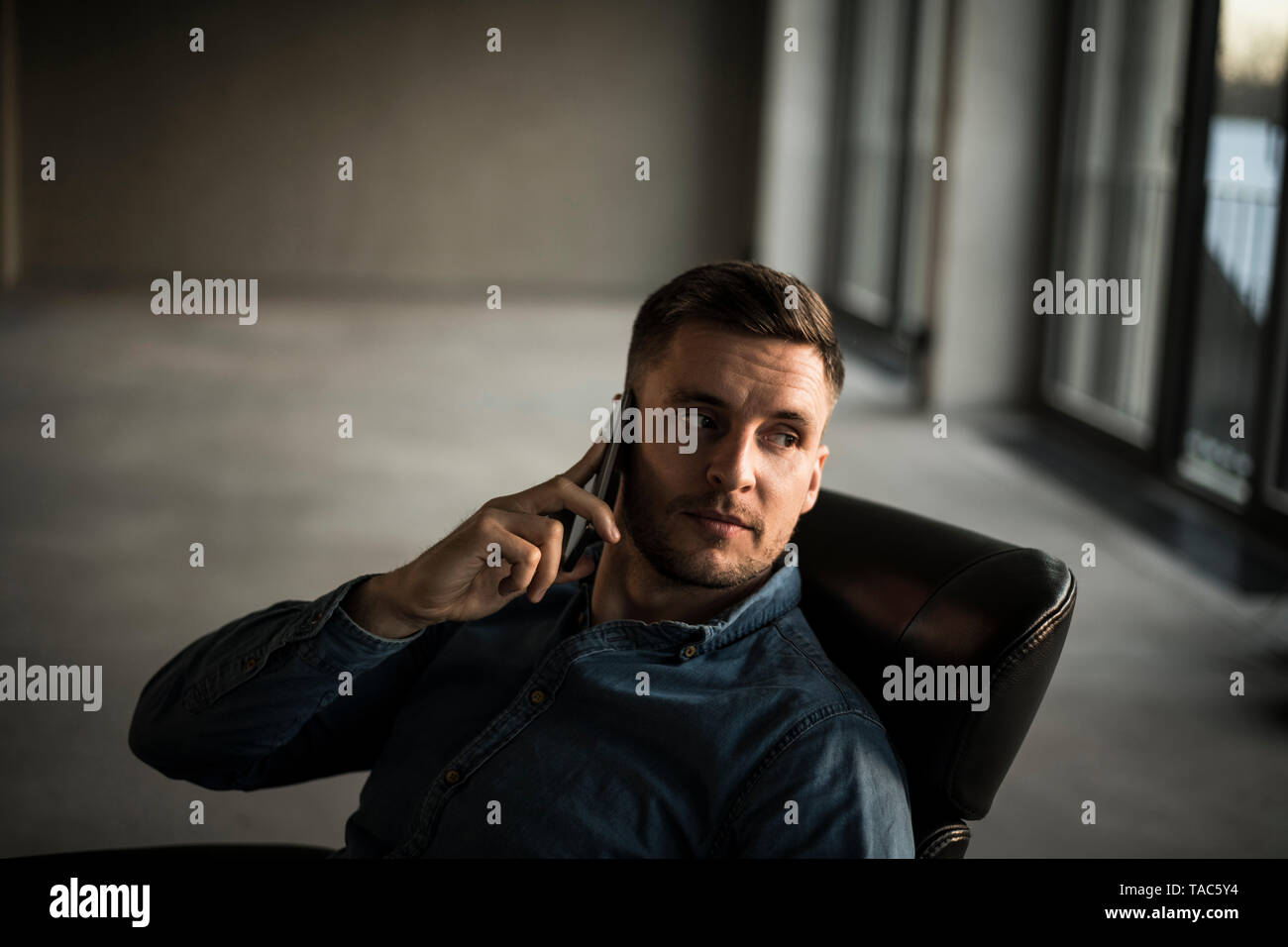 Young businessman talking on ghe phone Stock Photo