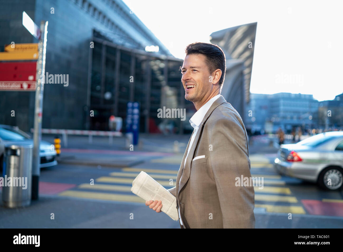 Happy businessman on the move in the city Stock Photo
