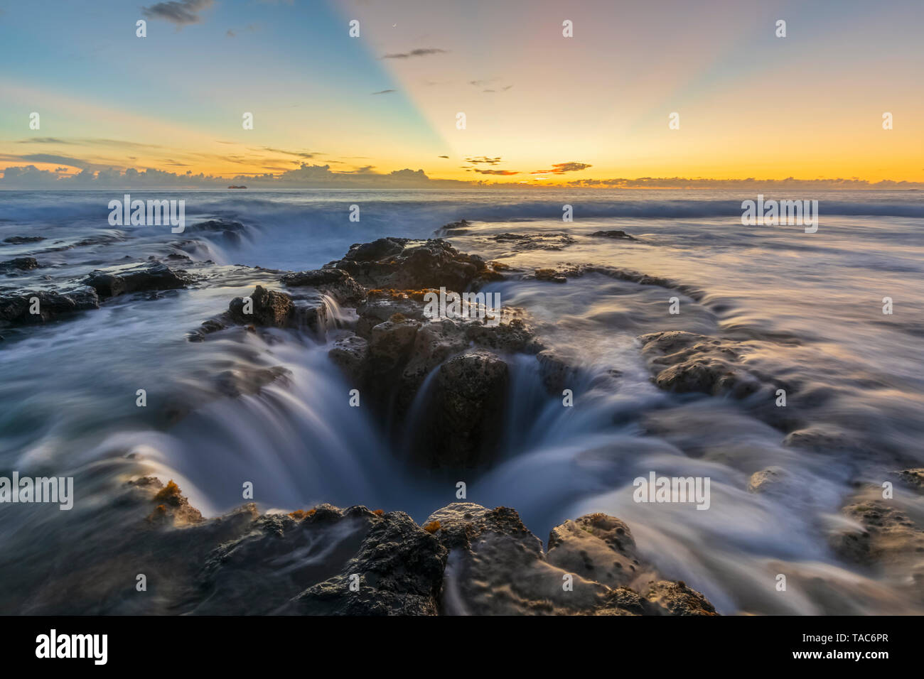 USA, Hawaii, Big Island, Kona, Pele's Well, Blowhole at aunset Stock Photo