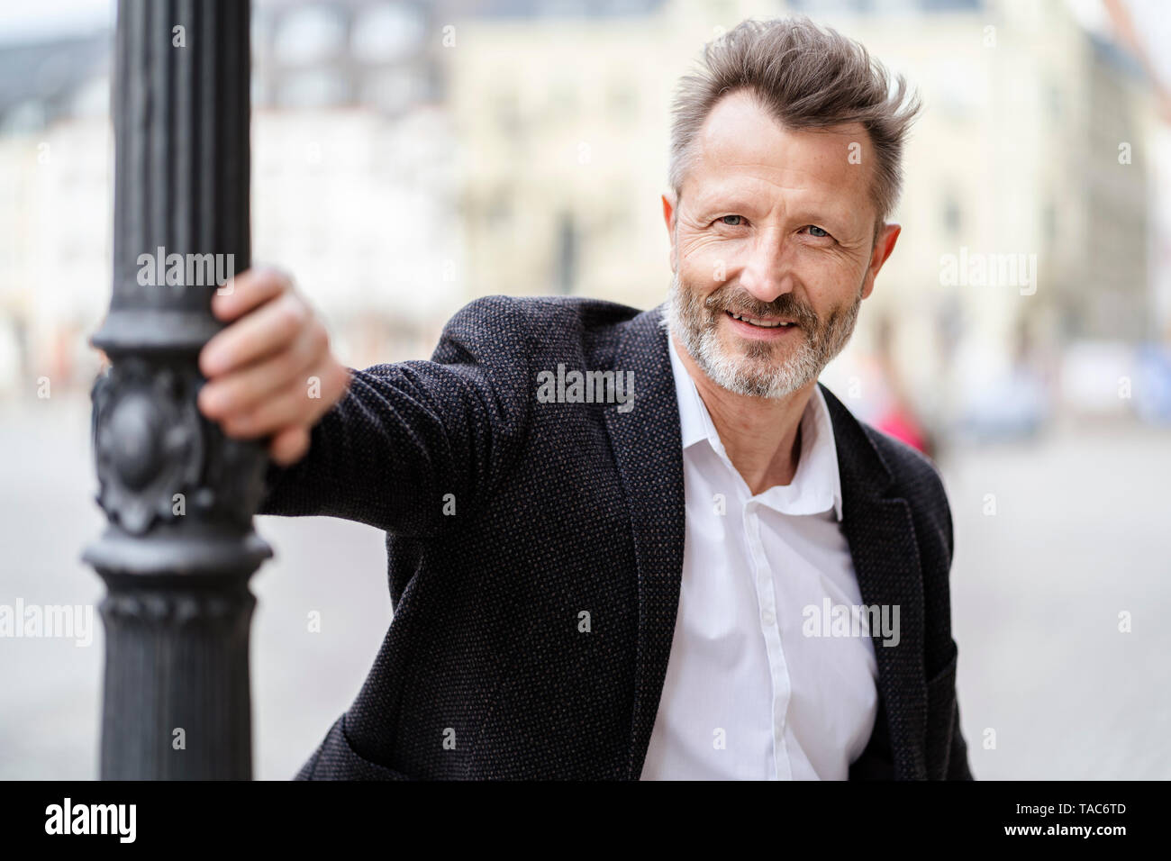 Portrait of smiling mature businessman with greying beard Stock Photo