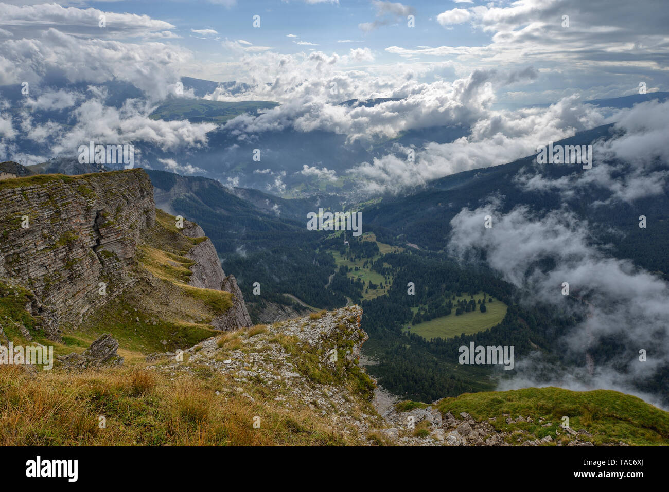 Italy, Dolomites, Sout Tyrol, View from the mountain Seceda over Val Gardena with dramatic clouds over mountains Stock Photo