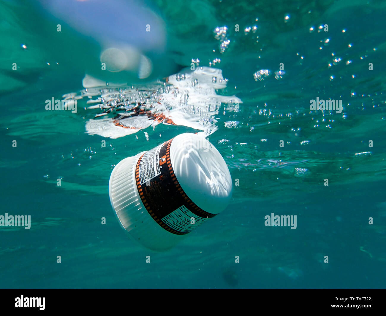 Plastic waste floating in the sea Stock Photo