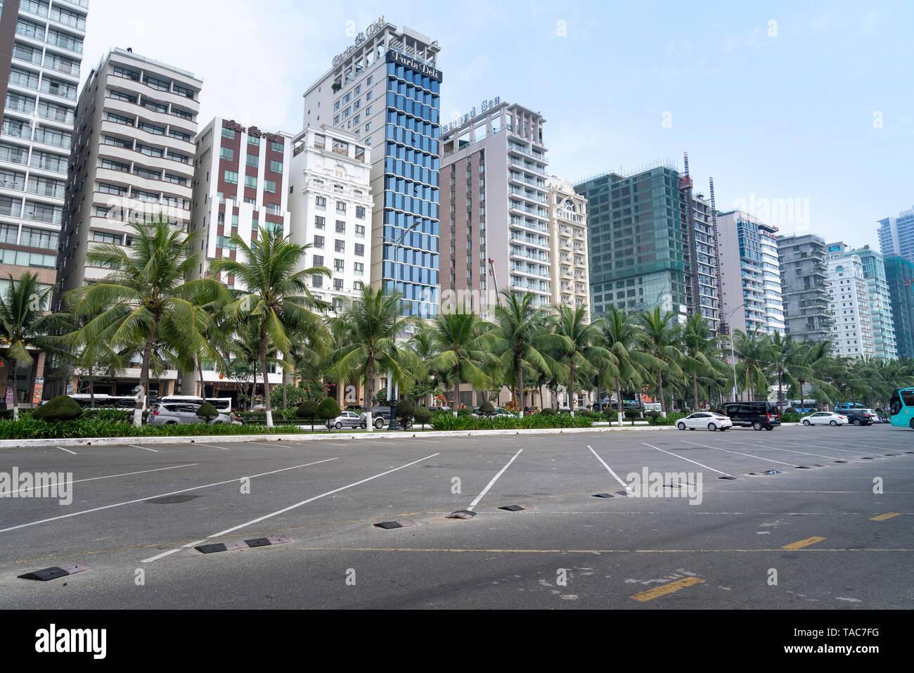 My Khe beach, Da Nang city, Vietnam - April 28, 2019: The seafront road (Vo Nguyen Giap Street) with the row of new multistory hotels on the left and Stock Photo