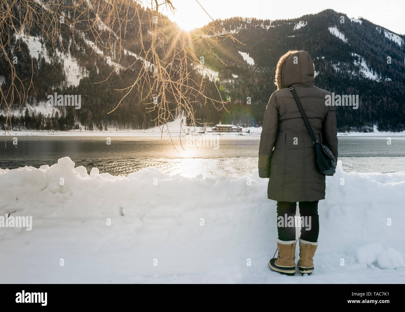 Woman lake winter hood rear view hi-res stock photography and images ...