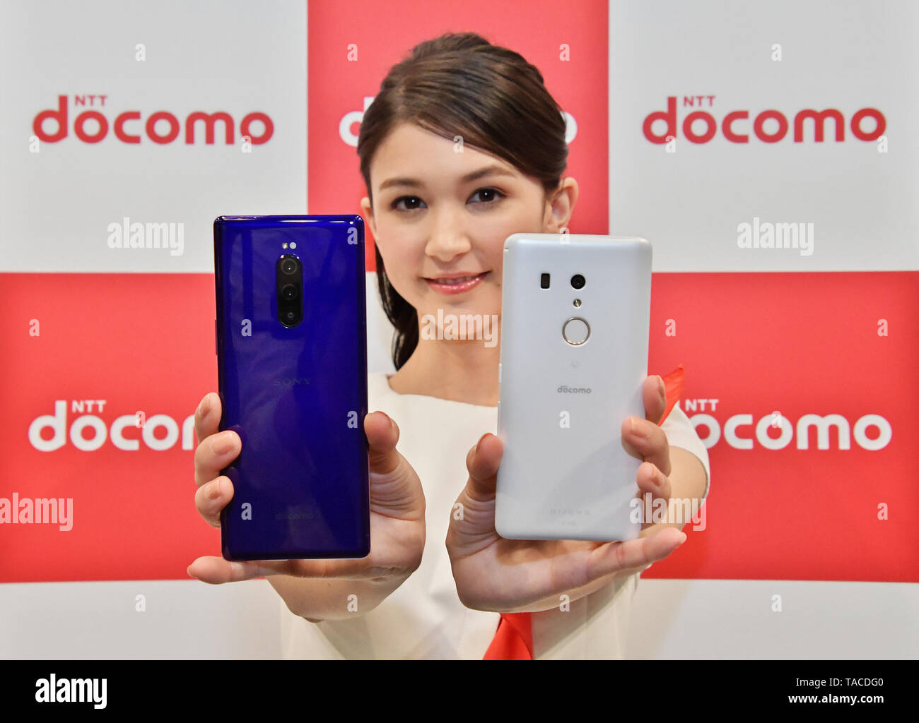 A model show new mobile devices (Xperia 1 SO-03L, arrows Be3 F-02L