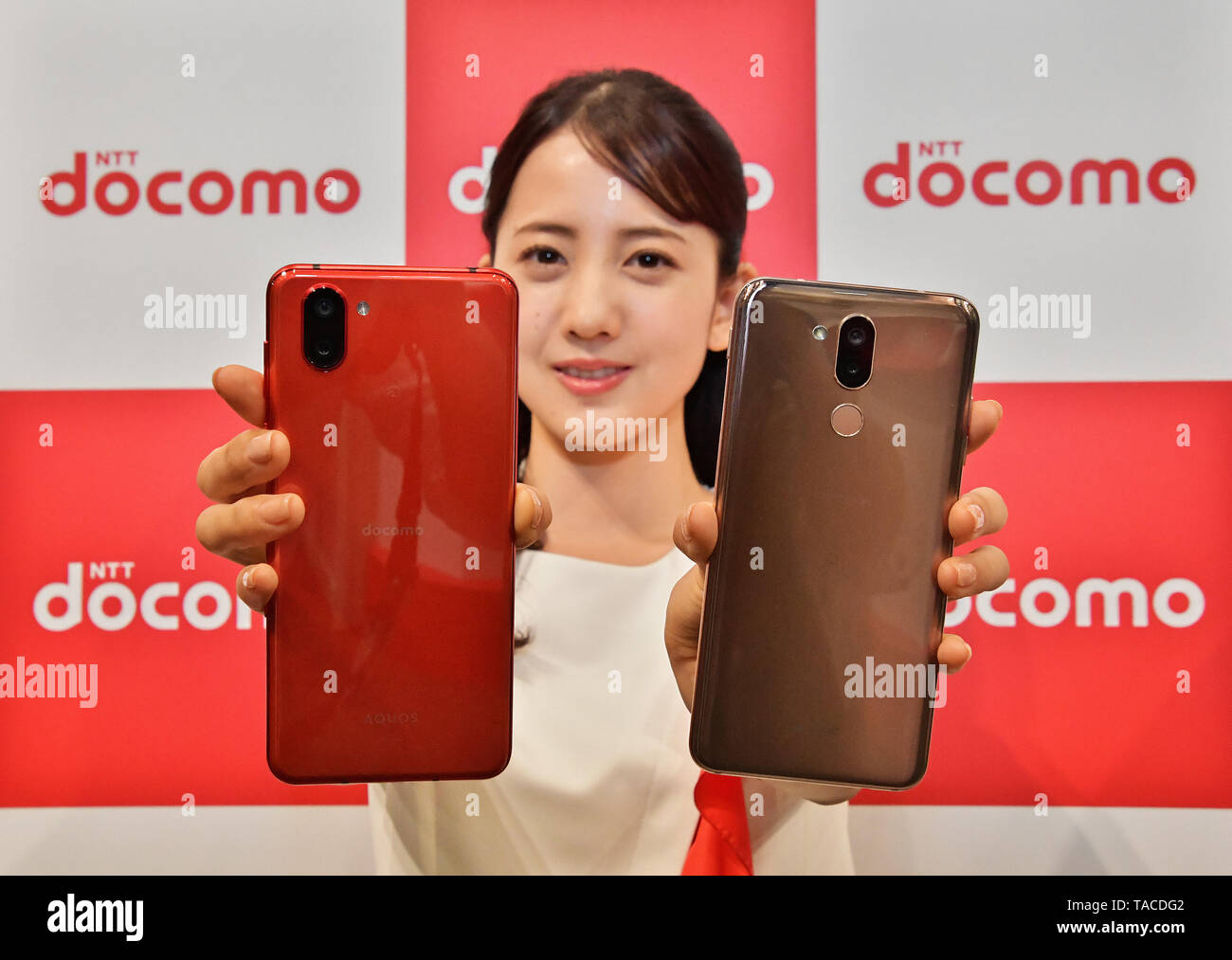 A Model Show New Mobile Devices Aquos R3 Sh 04l Lg Style2 L 01l During The Press Conference For Summer Lineup 19 And New Service Of Ntt Docomo In Tokyo Japan On May 16
