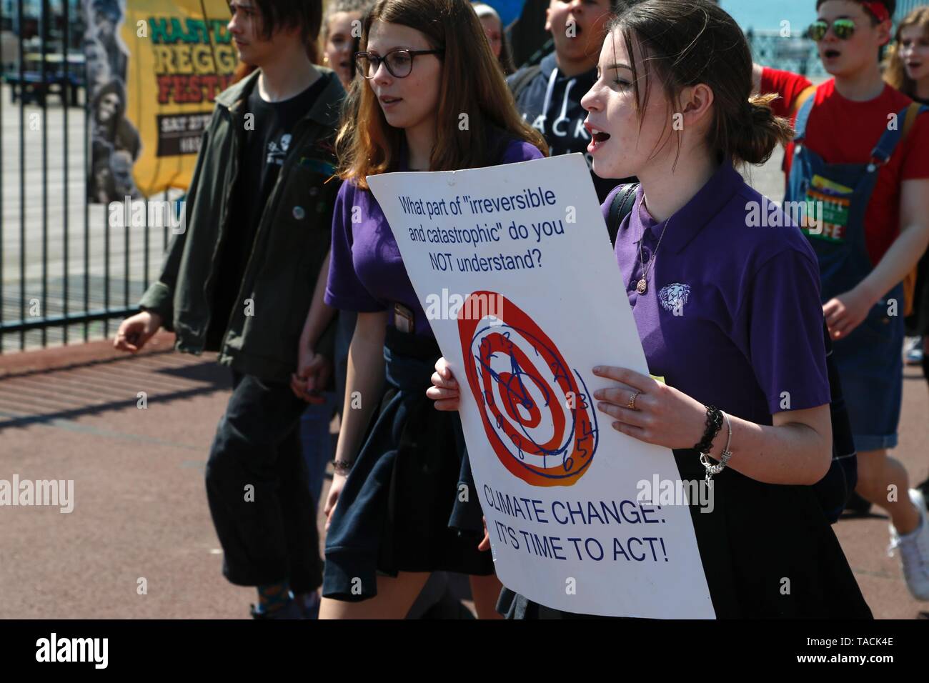 Hastings, East Sussex, UK. 24 May, 2019. Climate change: Approximately 150 young people aged from toddlers with parents and 18 year old students have taken to Hastings promenade to demand action for change. Lots of youths walk along the Hastings seafront shouting and waving placards regarding the current situation. Photo Credit: Paul Lawrenson/Alamy Live News Stock Photo