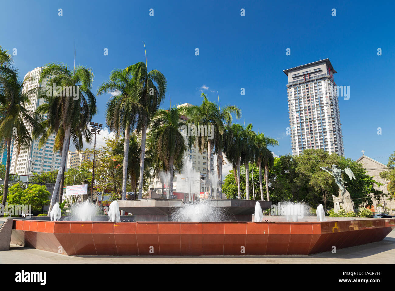A fountain with palms in Manila, Philippines Stock Photo