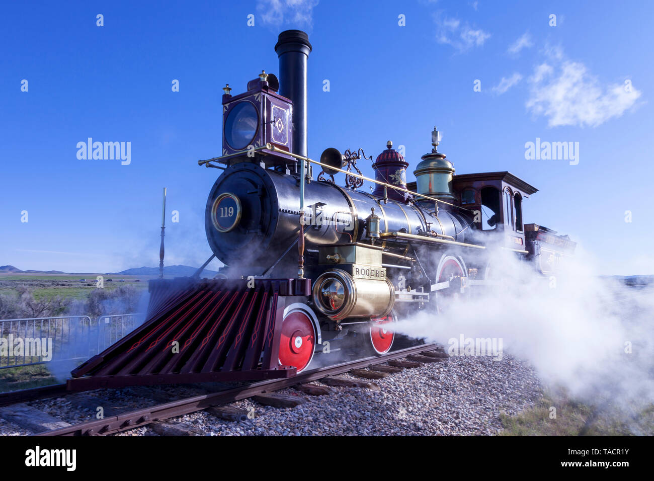 The Union Pacific Railroad's locomotive No. 119 belches steam as it makes its way into position for the ceremonies celebrating the 150th anniversary o Stock Photo