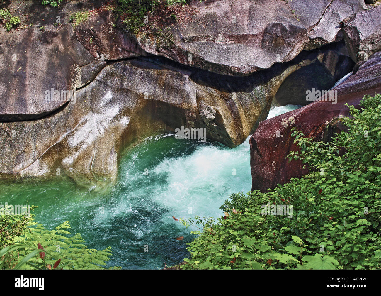 Beautiful granite rock formations of Babinda Boulders at Devil's Pool Lookout point where a whirlpool occurs in the wet season runoff of Babinda Creek Stock Photo