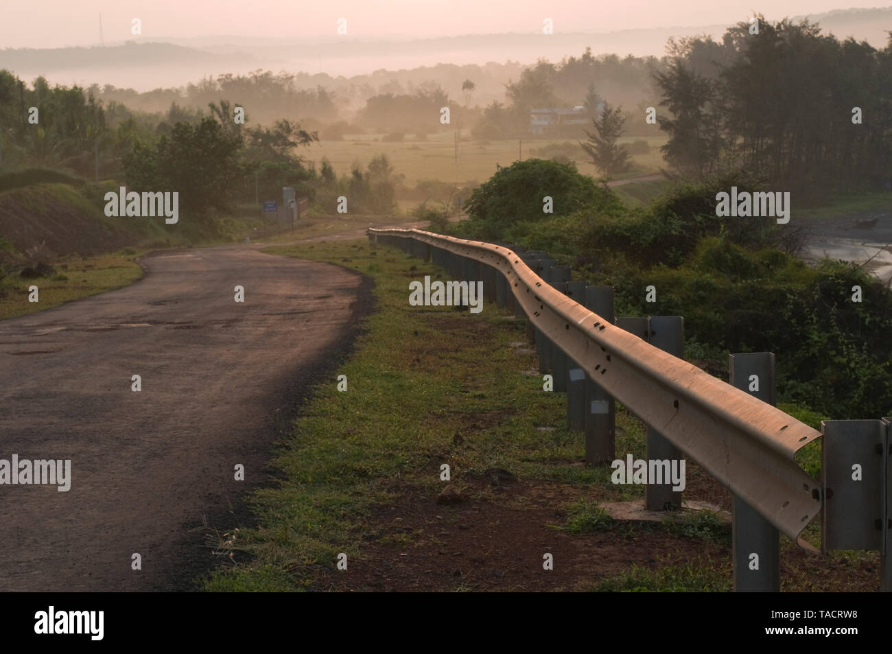 road with aluminum railing, Ganpatipule, Maharashtra, India, Asia Stock Photo