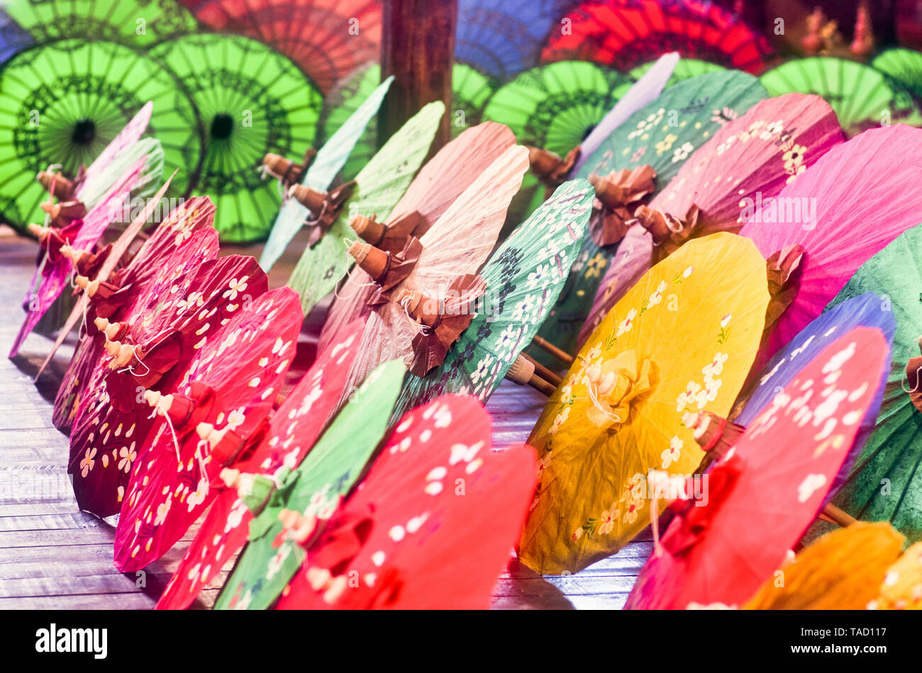 Colorful Chinese umbrellas resting on the floor Stock Photo